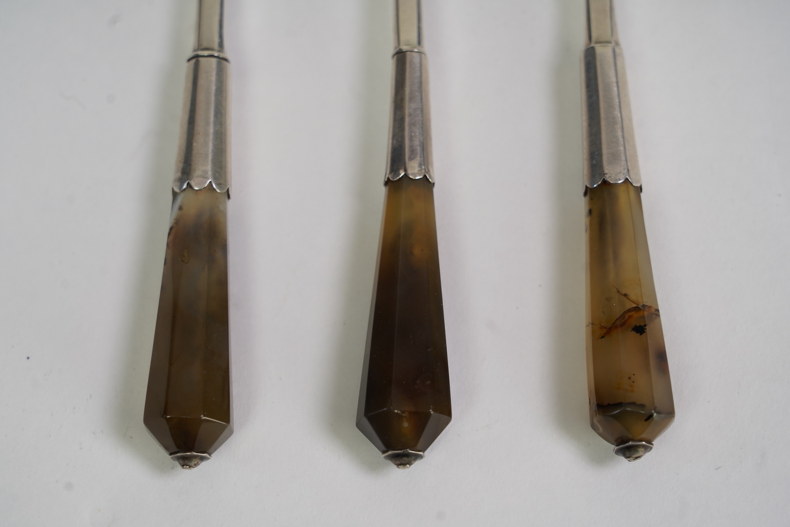 A set of three late Charles II agate handled silver three pronged forks, maker TZ with crown above and mullet below, (Jackson's ref. p.139)